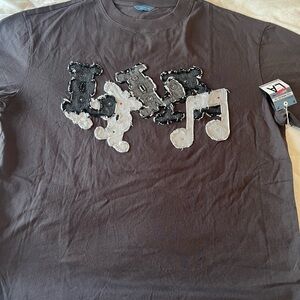 Trendy Brown Graphic Tee with Music Note Design